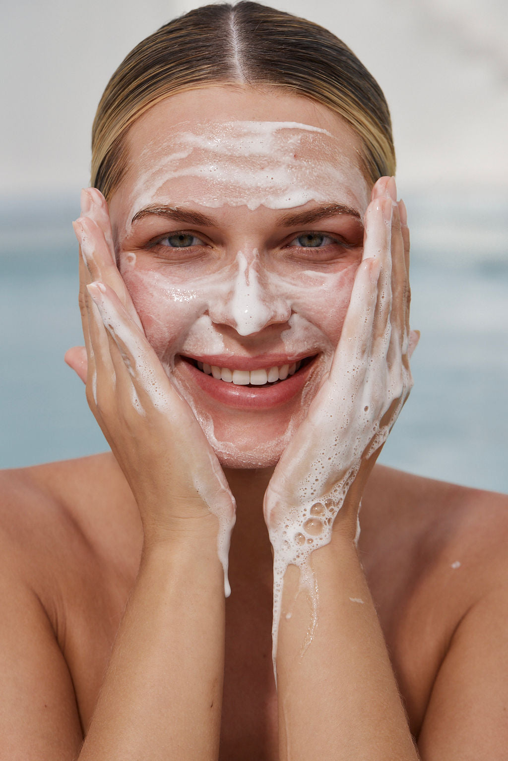 Woman washing her face